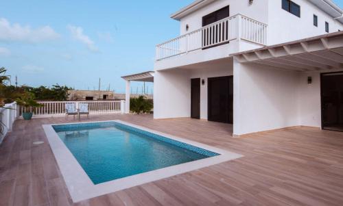 Leeward Settlement Apartment | Stay in a Long Bay Beach Villa with a Shared Pool