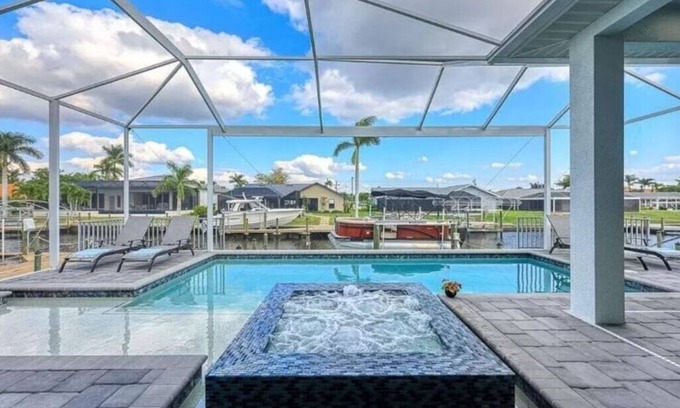 Eight Lakes House | Stunning New Waterfront Luxury Villa with oversized Heated pool and Hot tub!