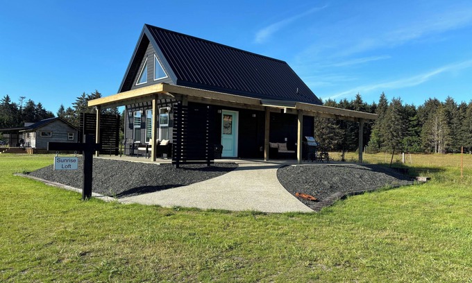 Moresby Island House | Sunrise Loft cozy private beach front house storm watching sleeps 4