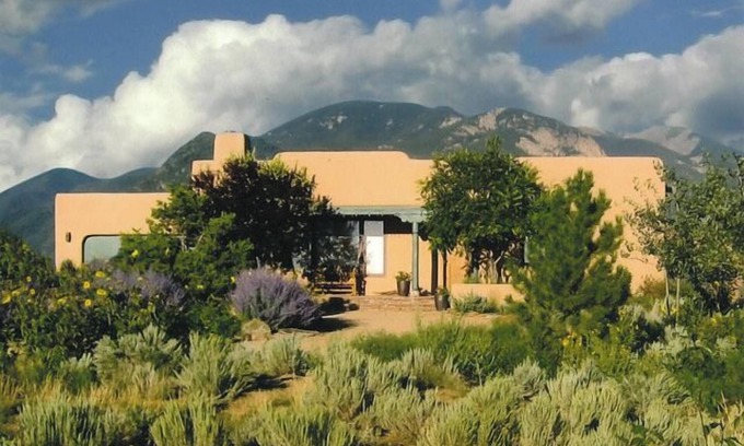 Arroyo Seco House | Sweeping panoramic mountain views, expansive adobe privacy wall system