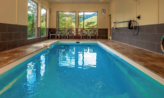 Gatlinburg - Pigeon Forge Cabin | The Refined Raccoon Retreat - Private indoor pool, firepit, game room, great views, and more!