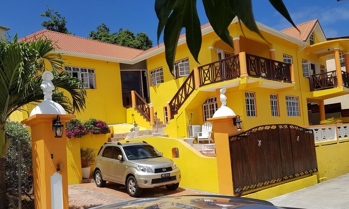 Dennery Apartment | Tropical spanish style suite with a fantastic mountain view