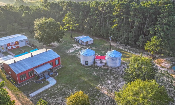 Navasota House | Unique Farmhouse with relaxing outdoor space- hot tub, fire ring & outdoor beds!