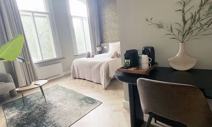 Centrum Apartment | Unwind in this refined suite, blending modern comfort with historic charm.