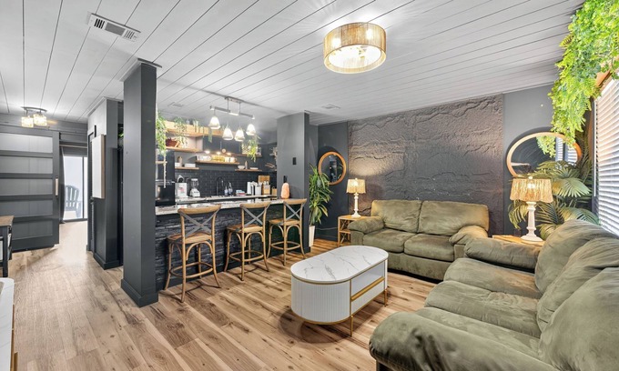 Holiday Beach Apartment | Urban Jungle Themed Apt - Shared Pool - Queen Bed
