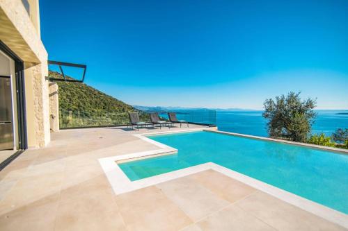 Petaleia Villa | Villa Nissaki View 3 by Villa Plus