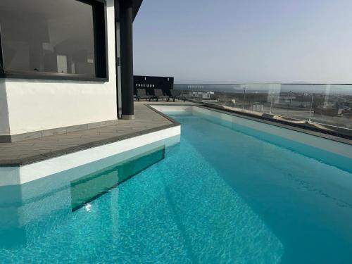 Corralejo Villa | Villa Poseidon Corralejo with Private Heated Pool, Sauna and Stunning Volcano Views by Amazzzing Travel