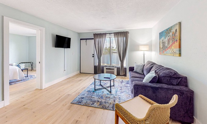 Isles of Capri Condo | Water-view Marco Island condo with firepit, grill, dock & W/D access