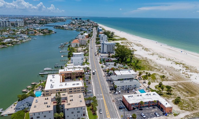 Treasure Island Condo | Waterfront Condo Pool Fishing Docks Across from the Beach