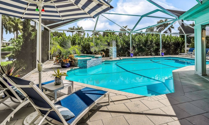 Yacht Club House | Waterfront escape in the heart of the action with pool, spa, grill, & WiFi