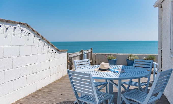 Sandgate Apartment | Wave Cottage - seaside cottage right on the beach by Bloom Stays