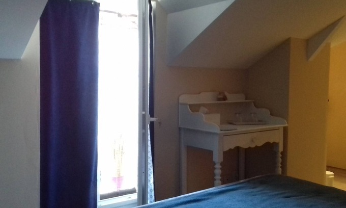 Bauge House | White room with private shower room and WC