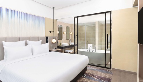 Junior Suite with King bed, city view, 15% F&B discount, 4 pieces laundry