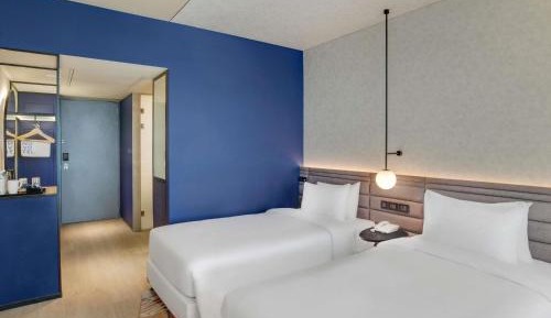 Premier Twin Room with Complimentary IMFL from 6:00 pm to 8 pm at Barcode and Shared Airport Transfer