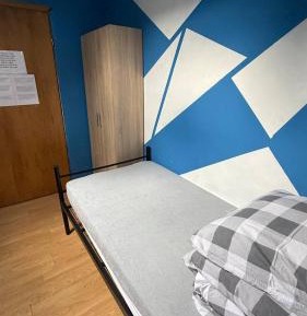 Single Bed in Dormitory Room
