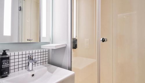 Room with One Queen Bed and One Bunk Bed