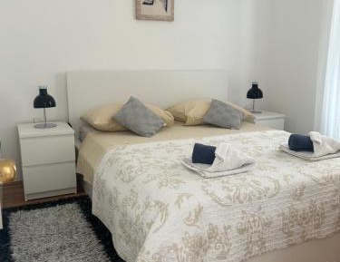 Two-Bedroom Apartment with Balcony and Garden View