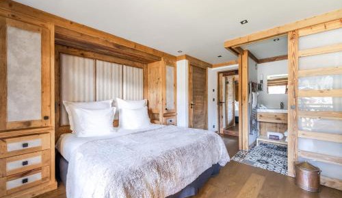 Comfort room with balcony and village view