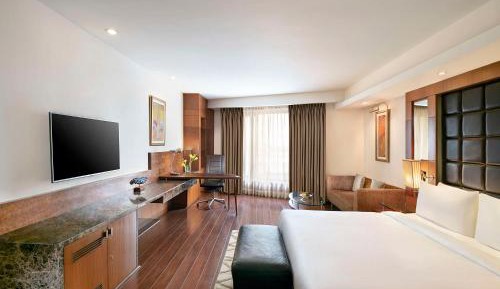 Deluxe Room with Happy Hours 01:00 PM to 06:00 PM, one way Airport Transfers and Free Pick up and drop to Worldmark Aerocity (subject to car availability)