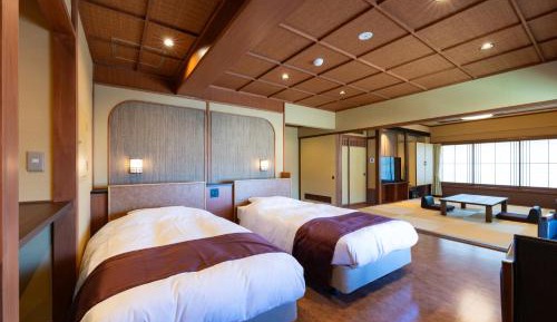 Standard Japanese-Style Room with Tatami Area and Garden View - Main Building