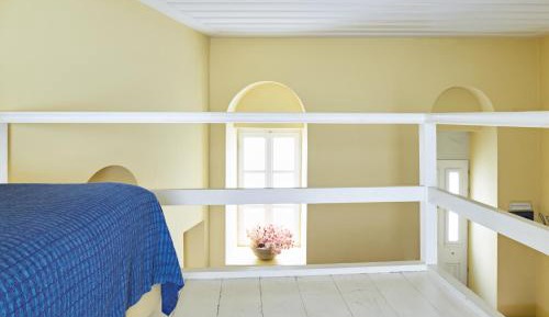 Blue and yellow attic studio