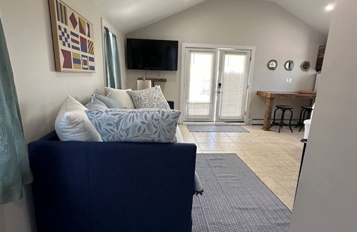 Patchogue Cottage | A charming yellow cottage , where you can place your feet in the sand and relax!