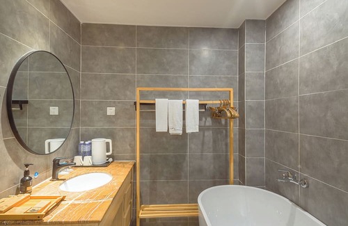 Emeishan House | Heinemann Hotel loft suite with two king beds A306— with a jacuzzi and a local