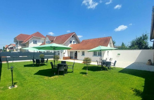 Buk Apartment | Holiday apartment on the ground floor, well-equipped kitchen and a view of the garden