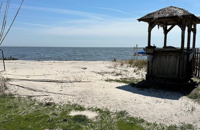 A charming yellow cottage , where you can place your feet in the sand and relax!
