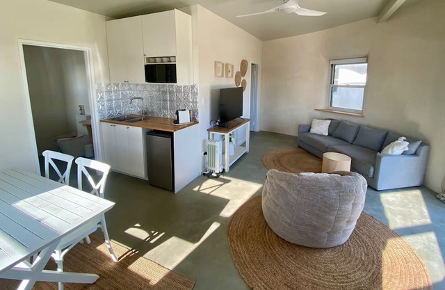 EXPERIENCE SERENITY IN A UNIQUE STRAWBALE RETREAT WITH BREATHTAKING VIEWS