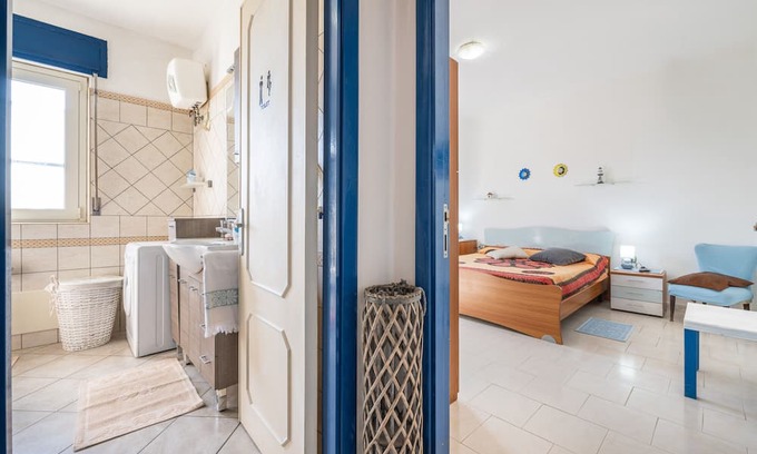 Giba House | Holiday Home 'La Casa Di Coccola' with Private Terrace, Wi-Fi and Air Conditioning