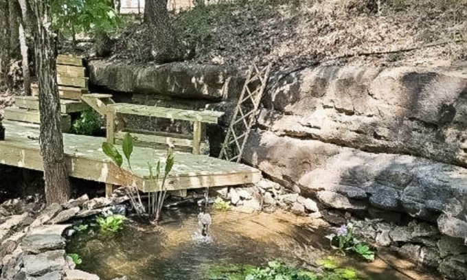 Lost Bridge Village House | Charming Retreat with Luxurious Amenities and Unique Cave Features