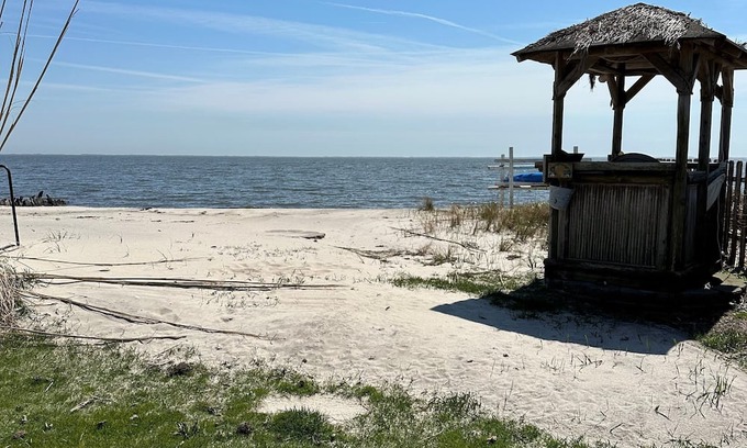 Patchogue Cottage | A charming yellow cottage , where you can place your feet in the sand and relax!