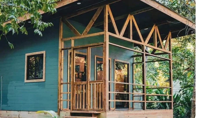 Bocas del Toro Cabin | Surfside tiny home with modern amenities like AC, modern design, bathtub,and TV.